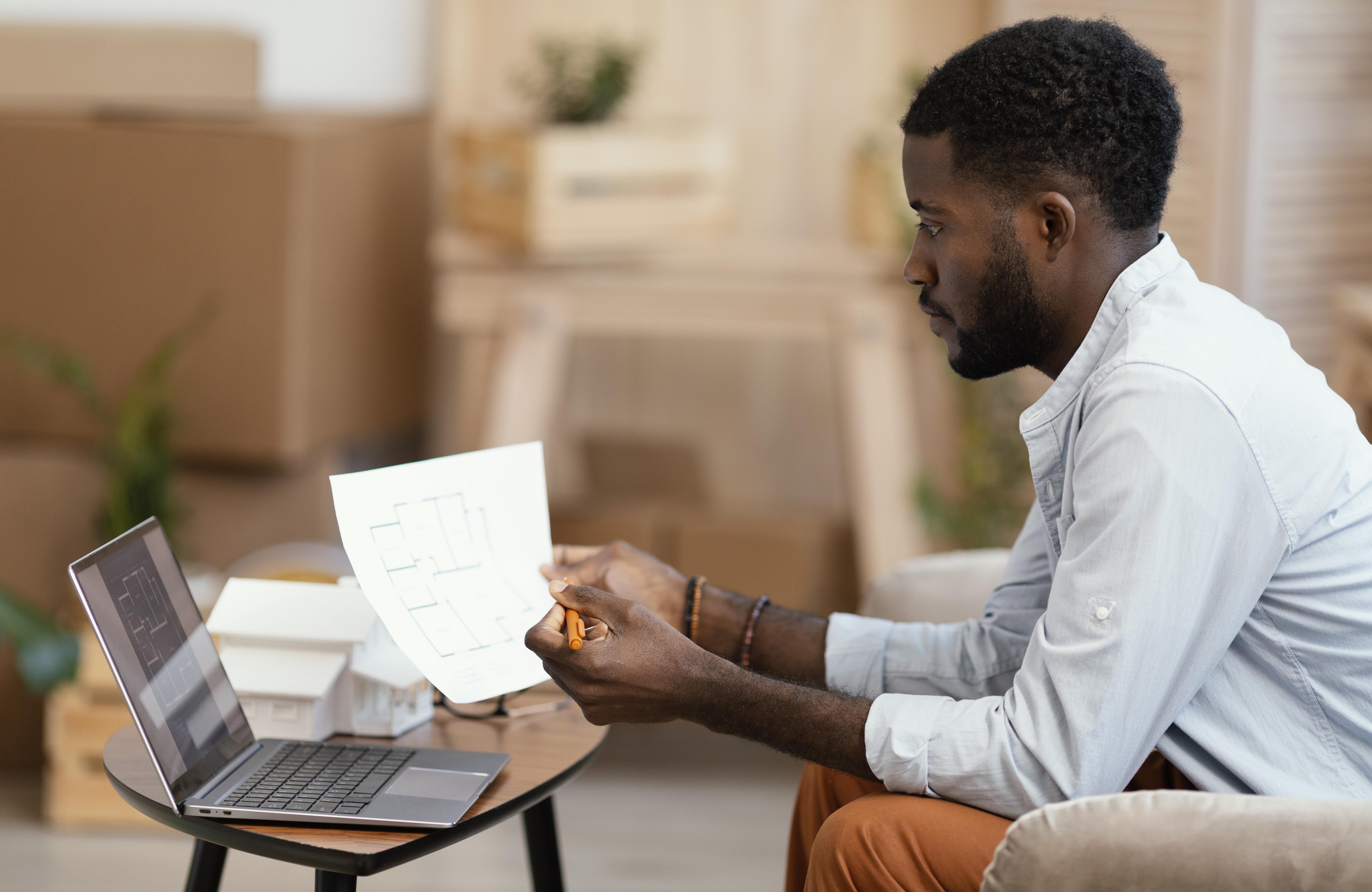 A woman in business attire reviewing her loan paperwork with confidence